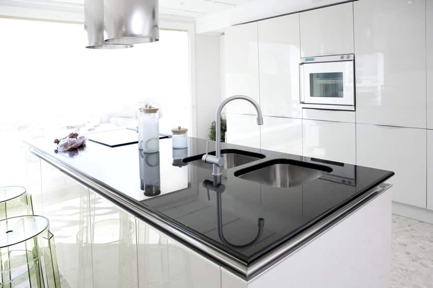 white kitchen island with black counter