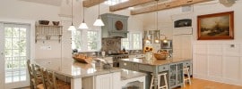 country-kitchen-with-bianco-carrara-marble-counters-and-exposed-beam-ceiling