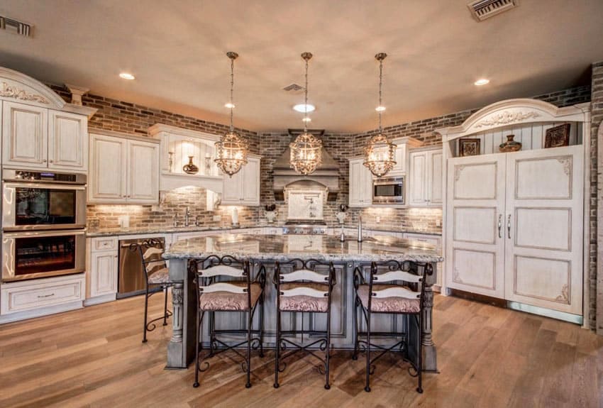 elegant kitchen with white cabinets and brick wall 2