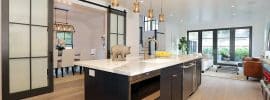 contemporary-kitchen-with-glass-panel-sliding-barn-doors-to-dining-room