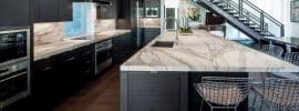 luxury-contemporary-kitchen-with-black-cabinets-marble-counter-island