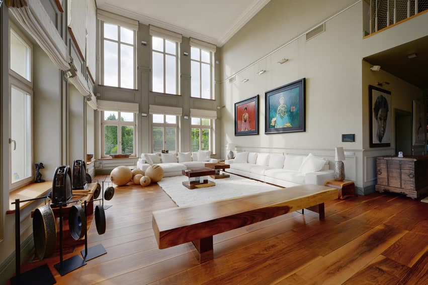 Art decor living room with white couch and large plank hardwood floor