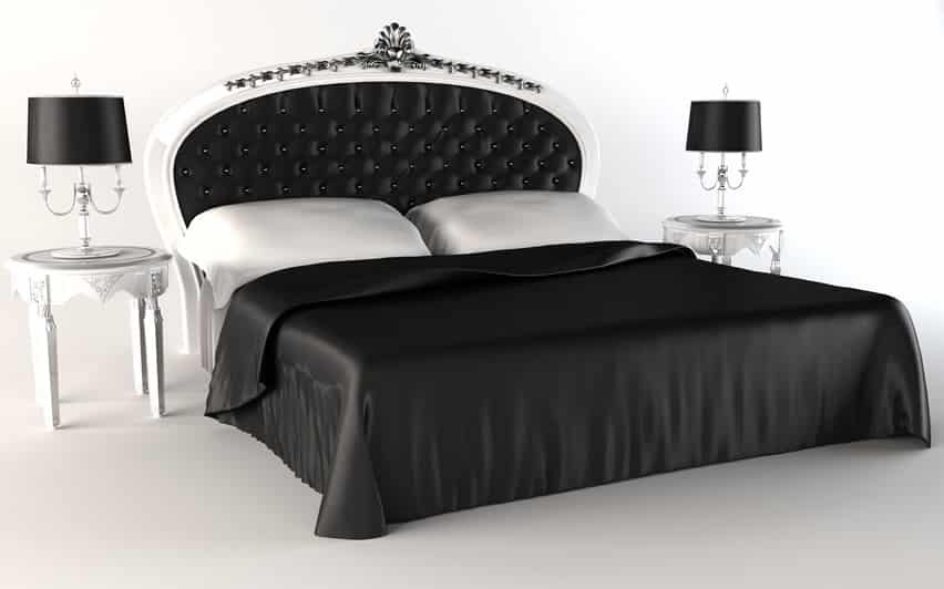 White walls and ceilings, black satin sheets and white pillows