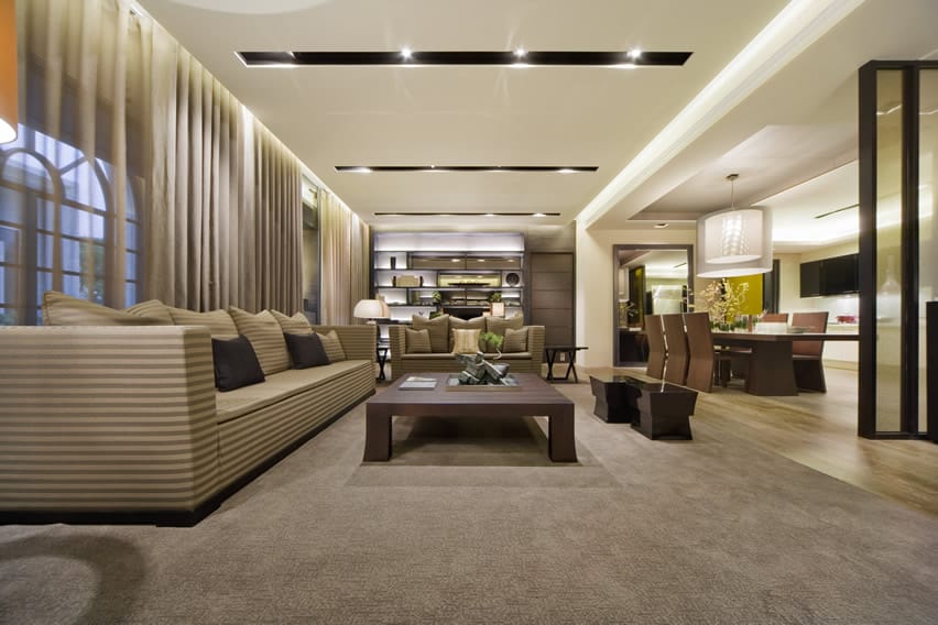 Brown themed living room with recessed lighting