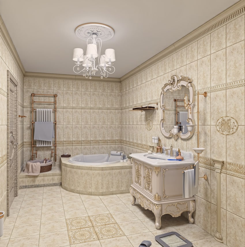 Tiled bathroom with chandelier and bathroom hardware with gold finishes