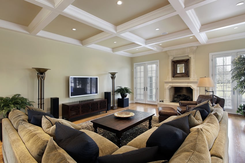 Family room with exposed beam ceiling and sectional couch