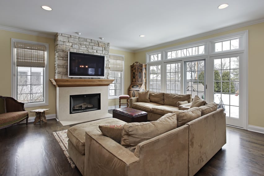 family room fireplace stone wall hardwood tv