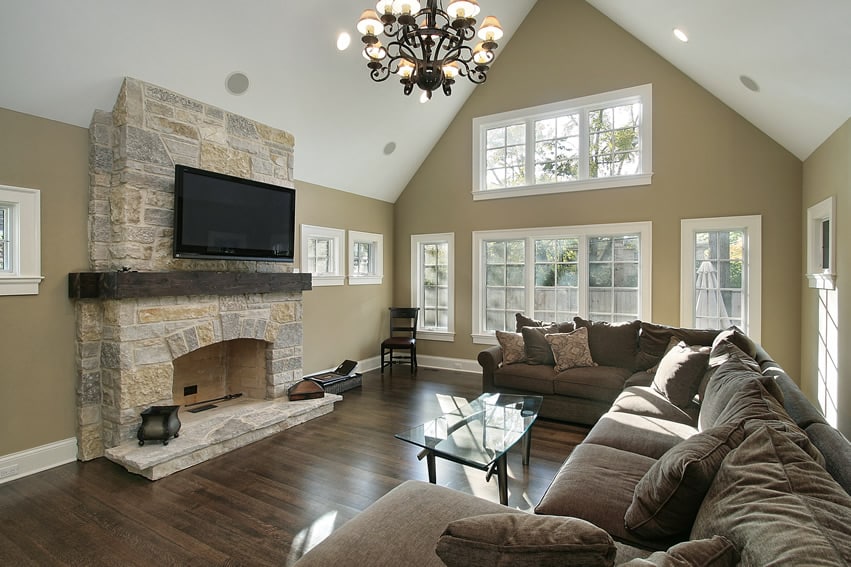 Family room with stone fireplace and brown design
