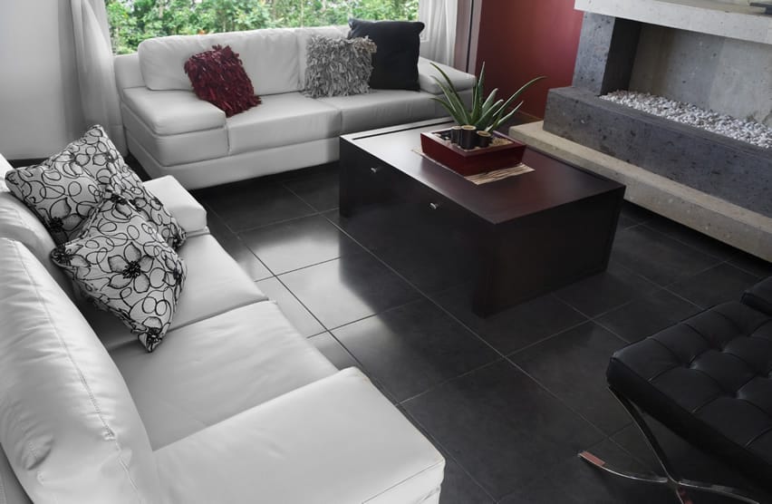 Black tile and white furniture with an indoor fire pit