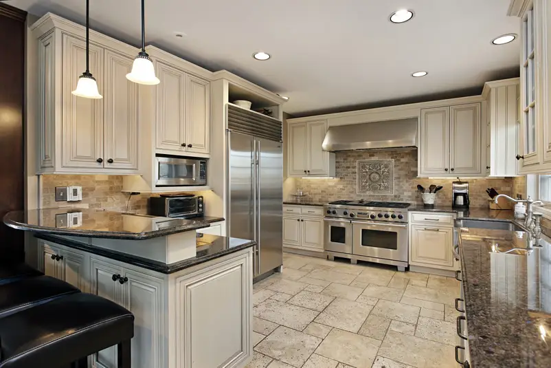 Luxury kitchen with cabinets, black granite and 