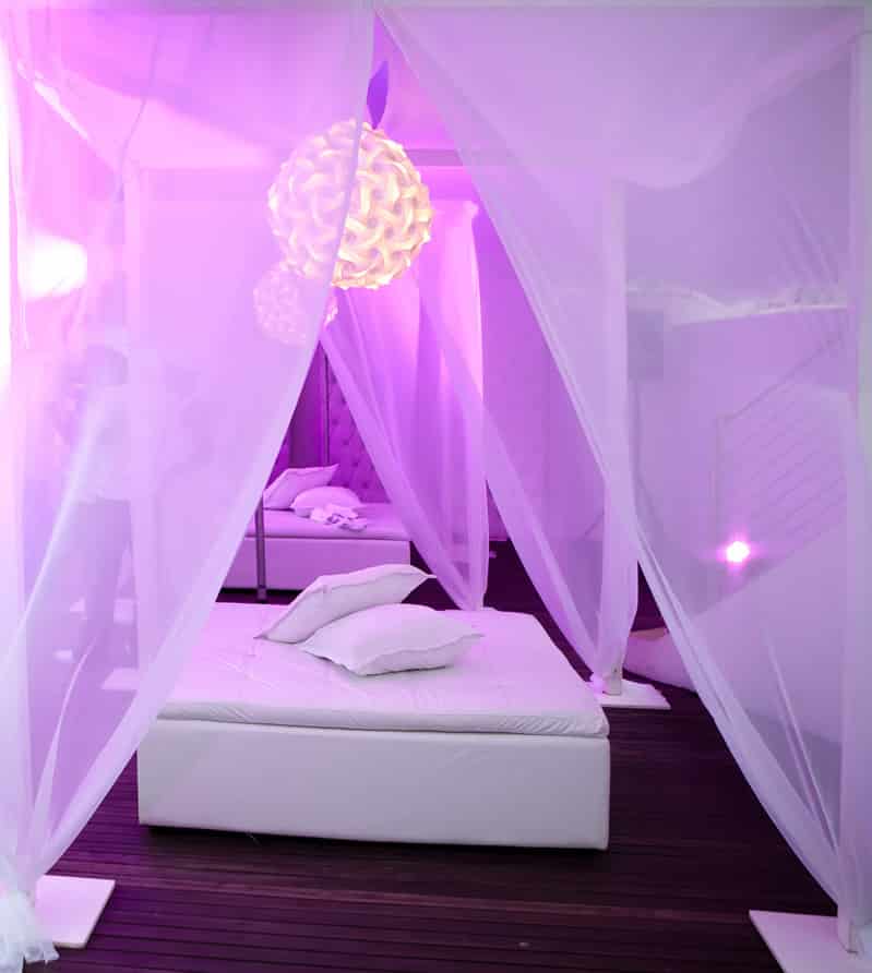 Luxury seating area in purple bedroom