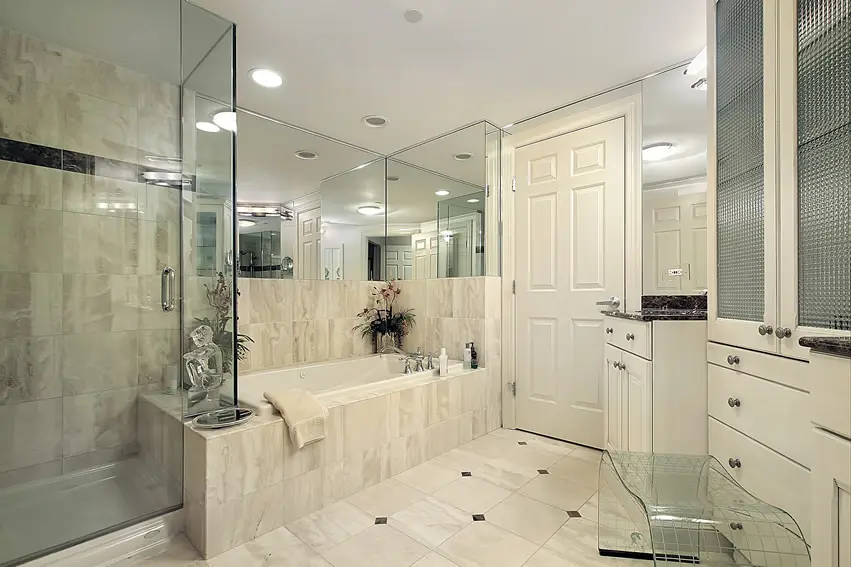 Master bathroom in white with large glass shower