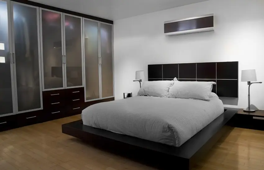 Room with black stained platform bed, beech floors and wengue drawers
