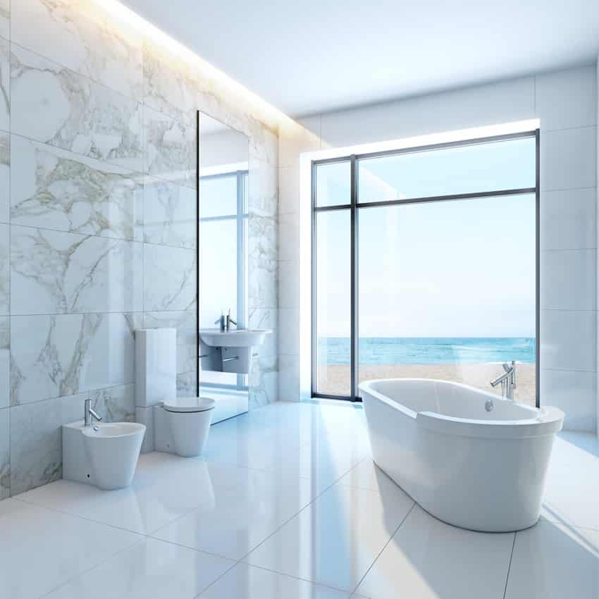 Bathroom with white marble, cove lighting and beachview