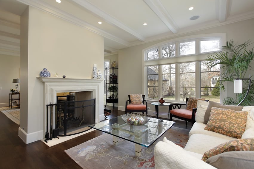 Tastefully decorated living room with white fireplace
