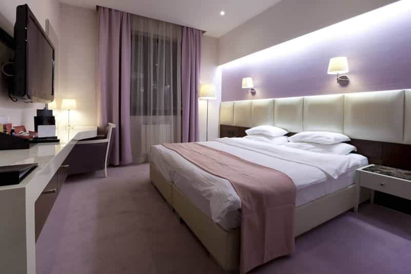Trendy purple themed hotel room