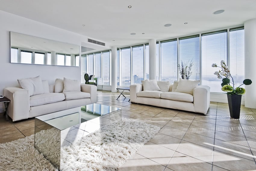 White decorated penthouse with wall of windows