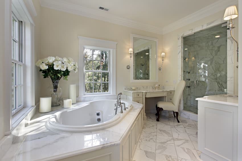 White colonial style master bath and marble flooring