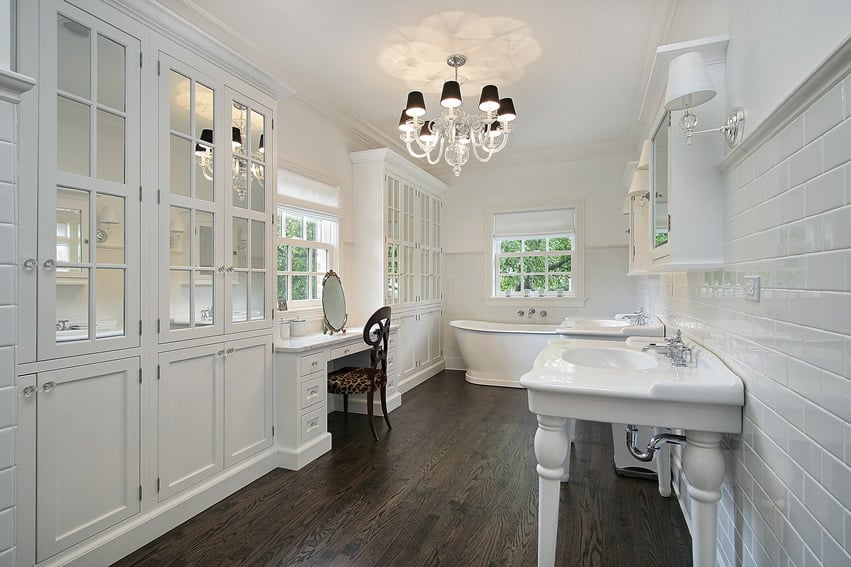 White master bathroom with white cabinets and makeup area