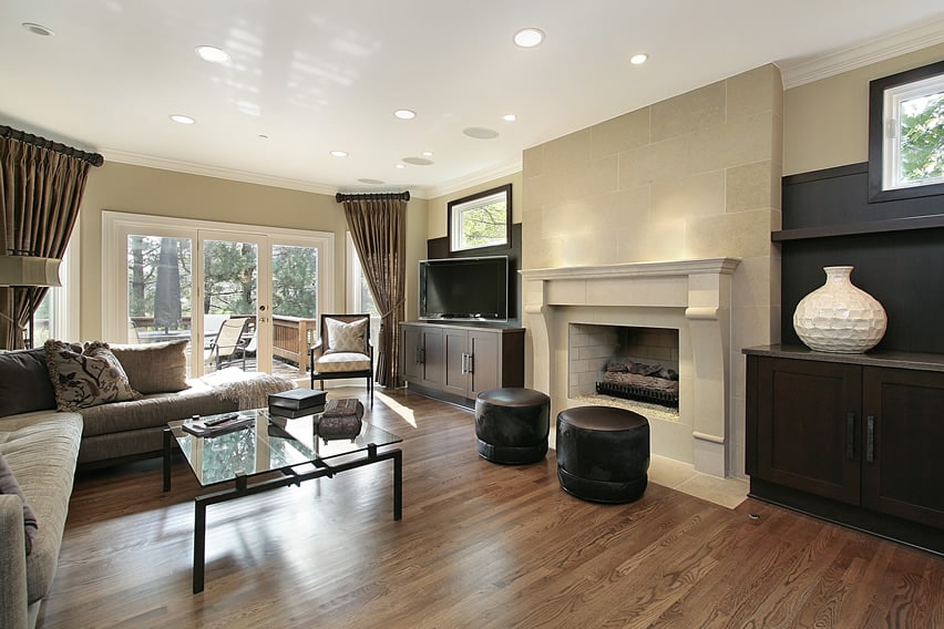 Attractive living space with large white mantle fireplace