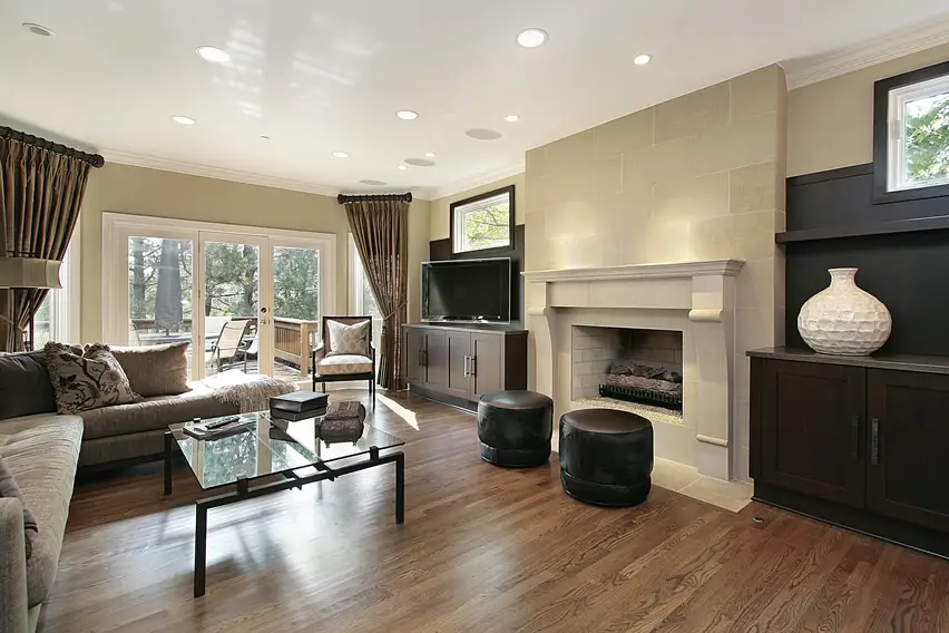 Attractive living space with large white mantle fireplace