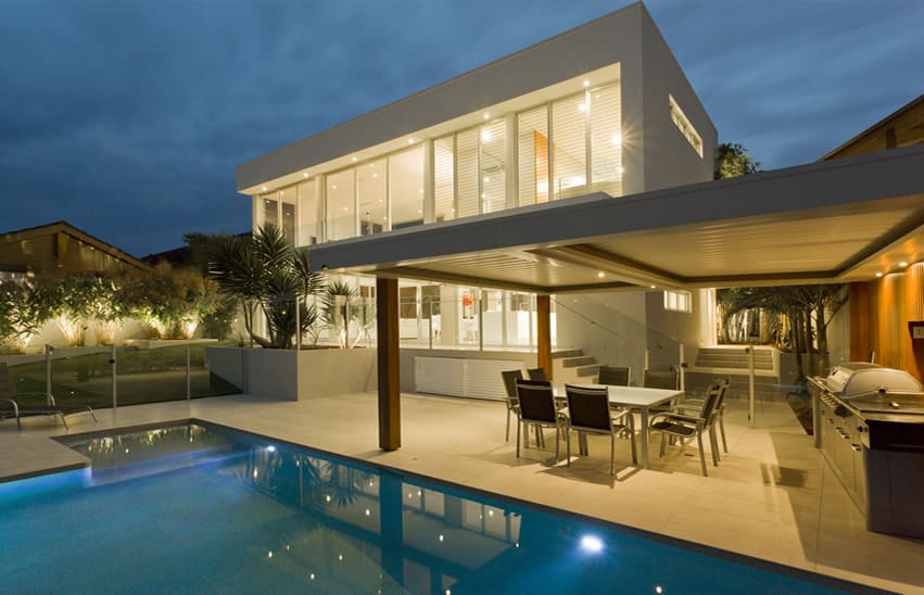 Pool with mini pebble finish and patio attached to the main house