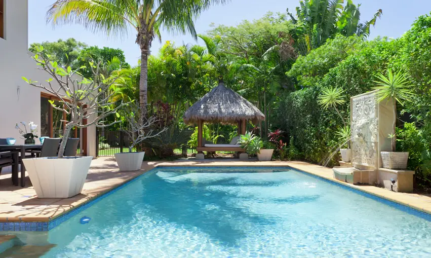 Pool with gazebo with orange poolside tiles