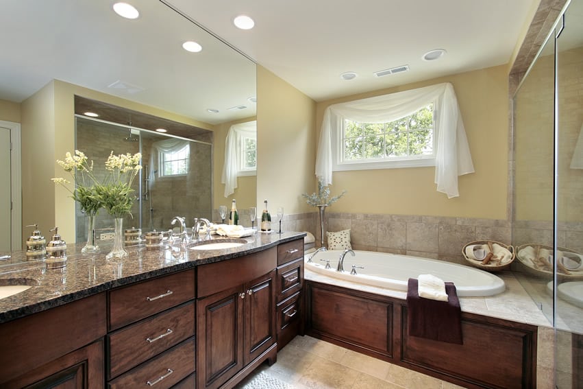 Master bathroom with Baltic brown granite countertop and Maple wood cabinets