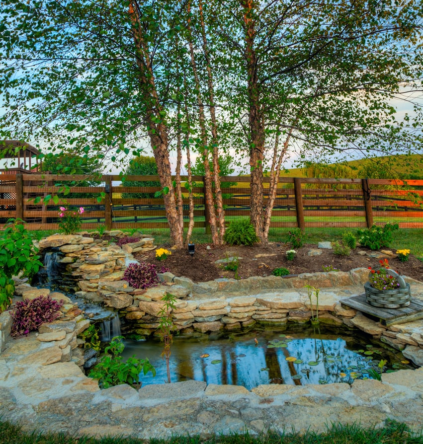 Beautiful stacked stone pond with waterfall