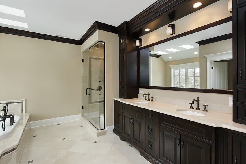 Master bathroom uses white stone finish ceramic tiles with accents of dark brown mosaic tiles