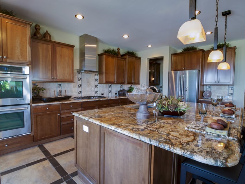 Beautiful designer kitchen with natural wood cabinets and large breakfast bar island with granite counter