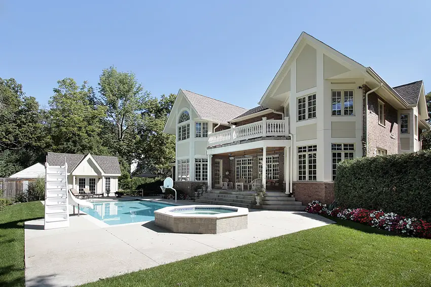 Rectangular pool with slide and basketball hoop