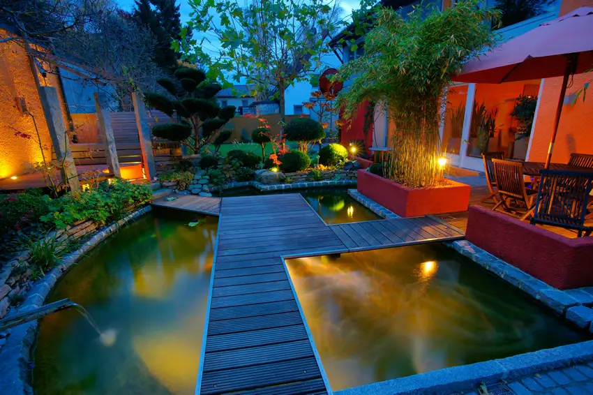 Beautiful lighted water feature with deck