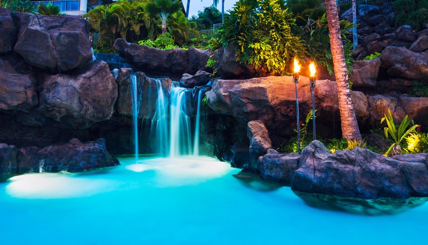 Beautiful lagoon swimming pool with rock waterfall