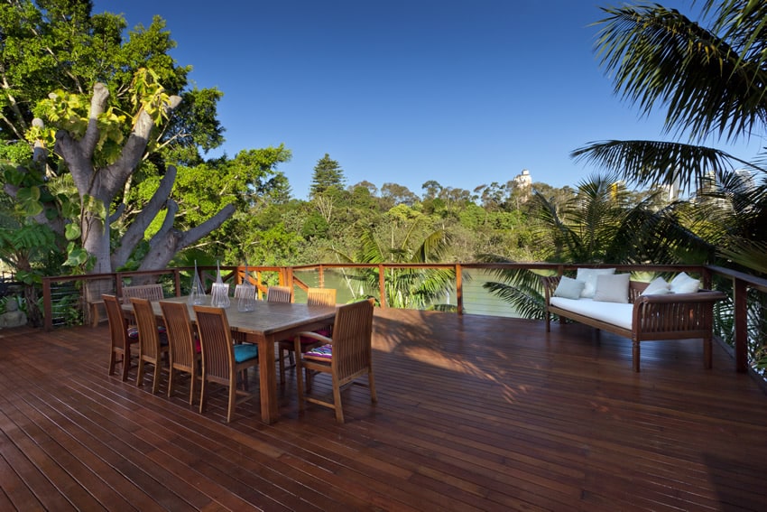 Beautiful waterfront wood deck with outdoor dining