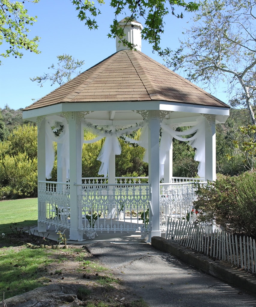 White octagonal wedding gazebo with tubular metal supports