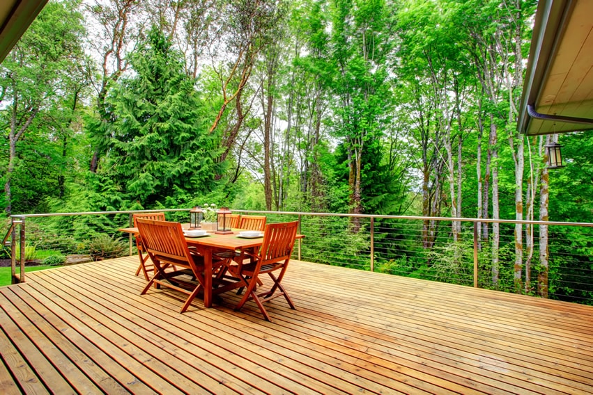 Beautiful wood deck with table and chairs and nature-view