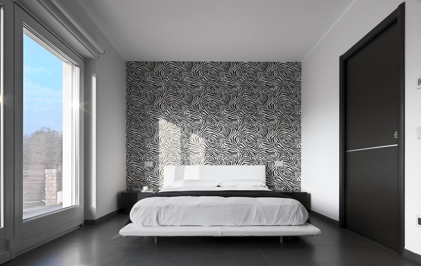 Bedroom with large plate glass window, and black tiles