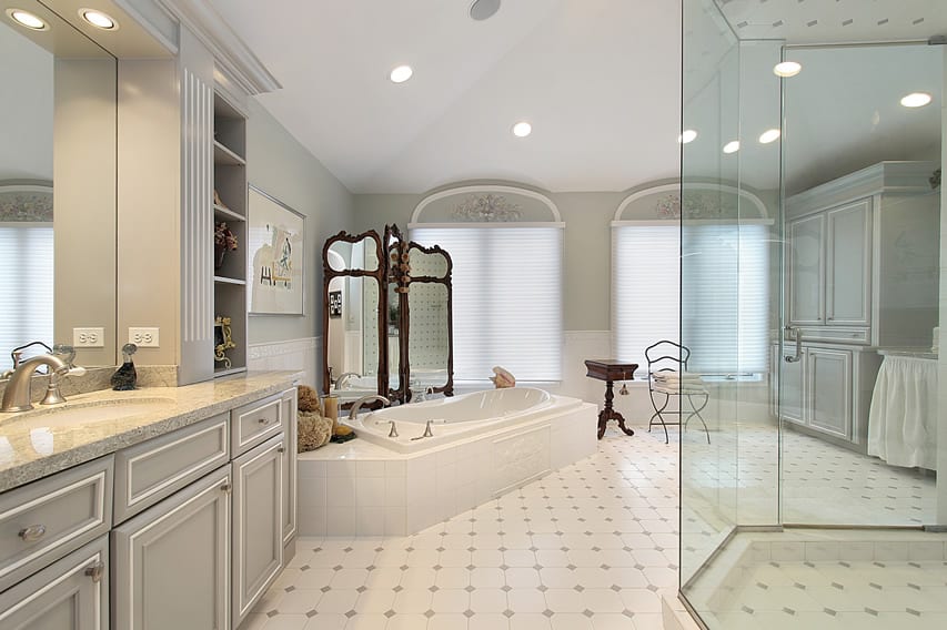 Large bathroom uses light finishes with white ceramic tiles and light gray diamond details