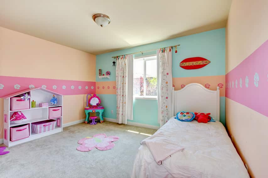 Pastel room with white single bed and storage cubby