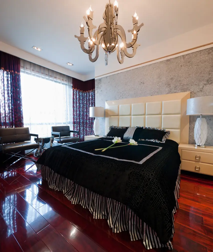 Contemporary bedroom with hardwood flooring