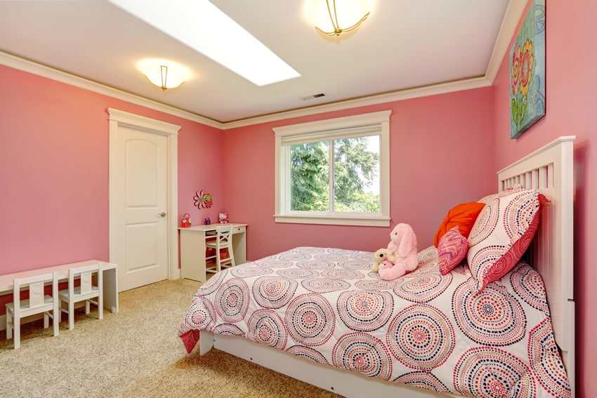 Pretty girl's bedroom with small desk, table and chairs