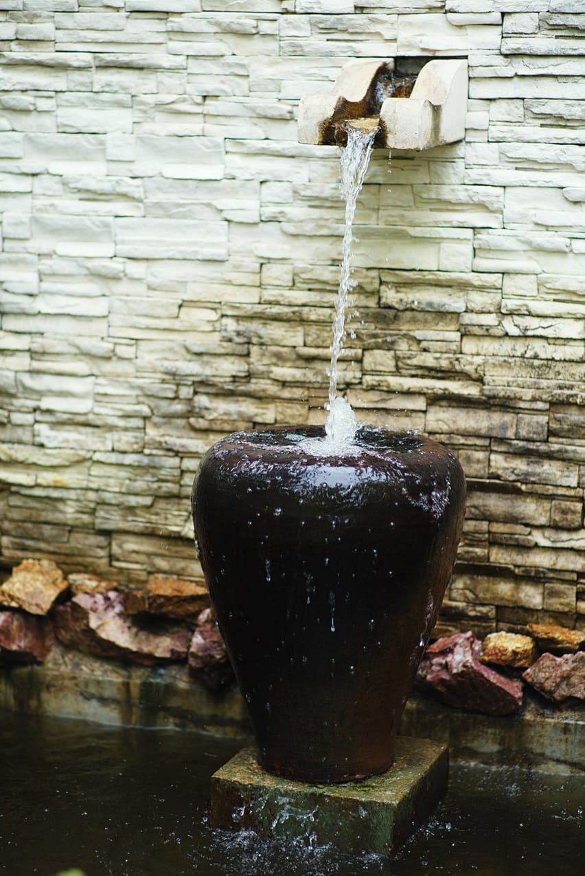 Decorative vase waterfall and deep pond