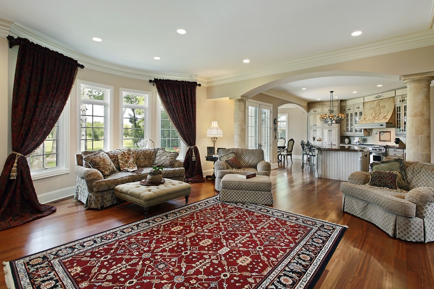 Elegant living room with large columns and hardwood floors