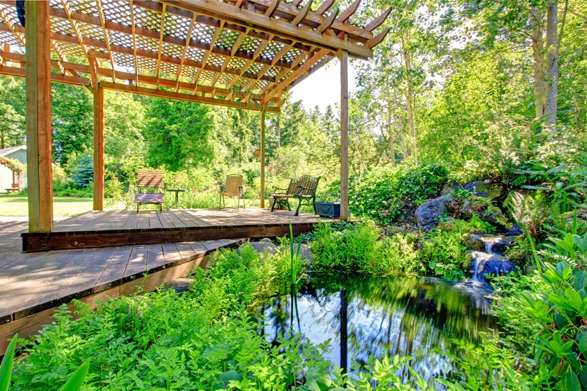 Garden pergola with waterfall and pond