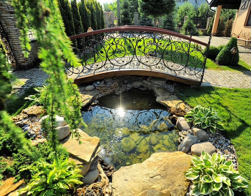 Garden pond with decorative bridge