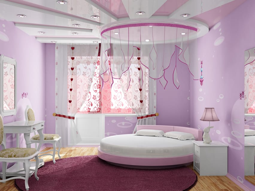 Pink bedroom with cute canopy over circular bed