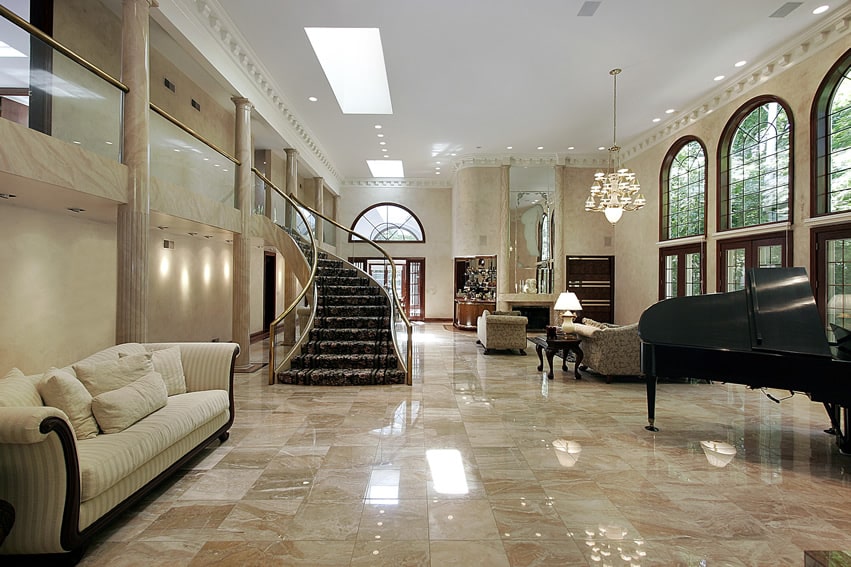 Huge living room with balcony, marble floors and grand piano