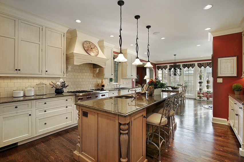 Kitchen with French doors and natural oak island body with baluster design