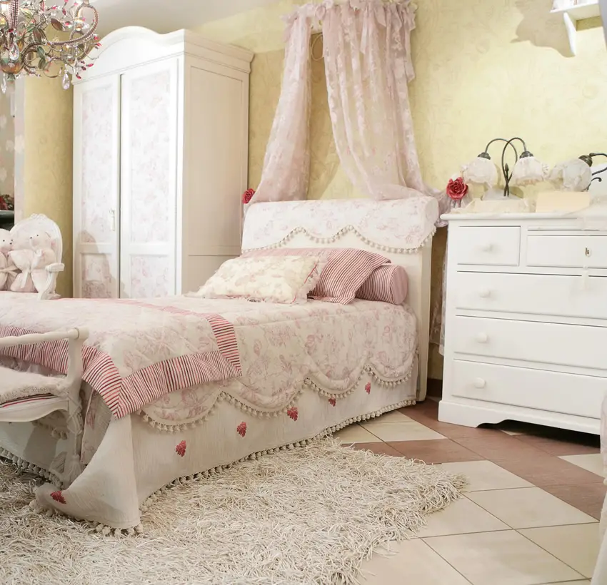 Sweet traditional girl's bedroom with canopy and elegant furnishings